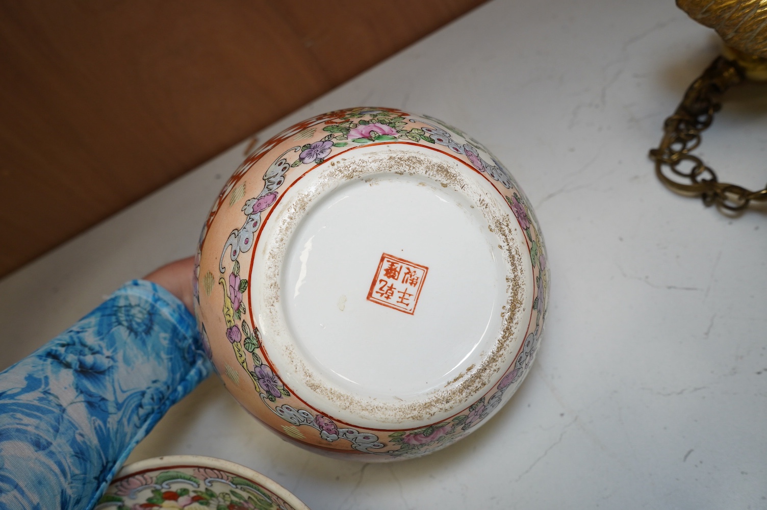 A 20th century Chinese famille rose bowl and a pair of jars and covers, bowl 26cm diameter. Condition - good